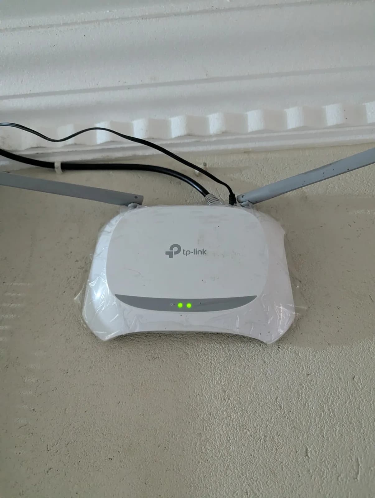 TP-Link router mounted on a wall with the Starlink cable run neatly in Chinhoyi, Zimbabwe